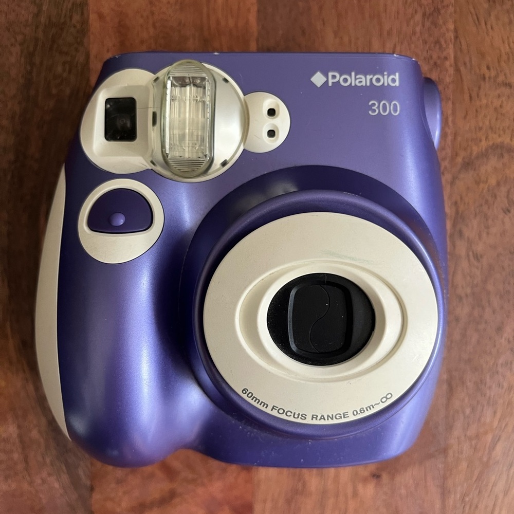 Purple Polaroid 300 instant camera